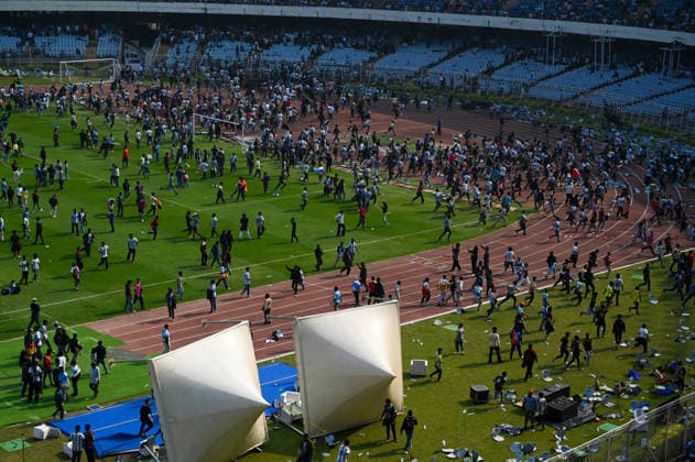 KOLKATA, INDIA - DECEMBER 13: Angry fans vandalise banners, throw bottles, ripped up seats and threw them on the pitch after Argentina football star Lionel Messi s early departure from the Salt Lake Stadium during his India Tour, on December 13, 2025 in Kolkata, India. Football fans were angry that, despite buying tickets at steep prices, they were not even able to catch a glimpse of their favourite star. Lionel Messi is on his G.O.A.T. India tour 2025, and he arrived in Kolkata in the early hours of Saturday (December 13, 2025). (Photo by Samir Jana Hindustan Times ) Argentina Football Star Lionel Messi Visits Kolkata: Upset Fans Vandalise Salt Lake Stadium