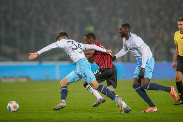 13.12.2025, xtgx, Fussball - 2.Bundesliga Hannover 96 - VfL Bochum emspor, v.l. Cajetan Lenz (Bochum, 34), Noel Aseko (Hannover, 15) Zweikampf, Duell, Kampf, tackle (DFL DFB REGULATIONS PROHIBIT ANY USE OF PHOTOGRAPHS as IMAGE SEQUENCES and or QUASI-VIDEO) Hannover