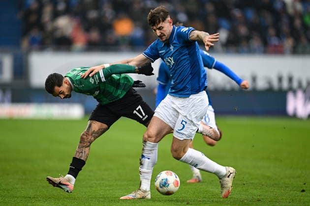 Oliver Batista Meier (Muenster 17) im Zweikampf mit Matej Maglica (SV Darmstadt 1898, 05), GER, SV Darmstadt 98 vs Preußen Münster, Fussball, 2. Bundesliga, 16. Spieltag, Spielzeit 2025 2026, 14.12.2025. DFL REGULATIONS PROHIBIT ANY USE OF PHOTOGRAPHS AS IMAGE SEQUENCES AND OR QUASI-VIDEO GER, SV Darmstadt 98 vs Preußen Münster, Fussball, 2. Bundesliga, 16. Spieltag, Spielzeit 2025 2026, 14.12.2025. Darmstadt