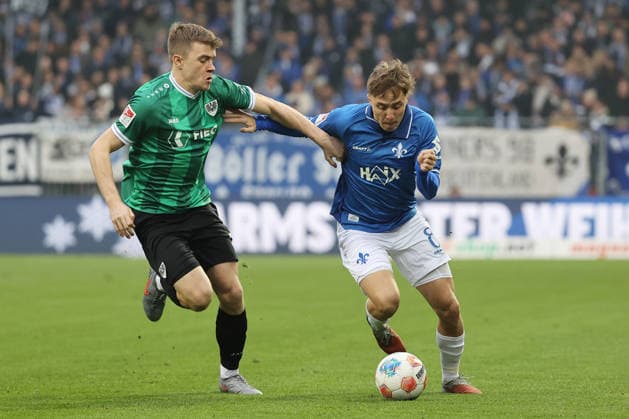 14.12.2025, xtvx, Fussball 2.Bundesliga, SV Darmstadt 98 - Preußen Münster v.l. Zweikampf, Duell, duel, tackle, compete Jano ter Horst (Preussen Muenster) Luca Marseiler (SV Darmstadt 98) (DFL DFB REGULATIONS PROHIBIT ANY USE OF PHOTOGRAPHS as IMAGE SEQUENCES and or QUASI-VIDEO) Darmstadt