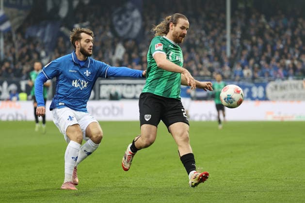 14.12.2025, xtvx, Fussball 2.Bundesliga, SV Darmstadt 98 - Preußen Münster v.l. Zweikampf, Duell, duel, tackle, compete Killian Corredor (SV Darmstadt 98) Jannis Heuer (Preussen Muenster) (DFL DFB REGULATIONS PROHIBIT ANY USE OF PHOTOGRAPHS as IMAGE SEQUENCES and or QUASI-VIDEO) Darmstadt