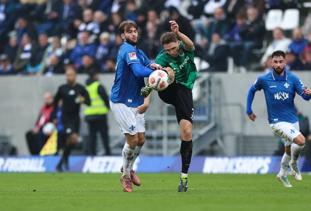 14.12.2025, Fussball 2. Bundesliga, SV Darmstadt 98 - SC Preußen Münster, emonline, emspor, despor, v.l., Killian Corredor (SV Darmstadt 98), Paul Jaeckel (SC Preußen Münster) DFL DFB REGULATIONS PROHIBIT ANY USE OF PHOTOGRAPHS AS IMAGE SEQUENCES AND OR QUASI-VIDEO. xdcx