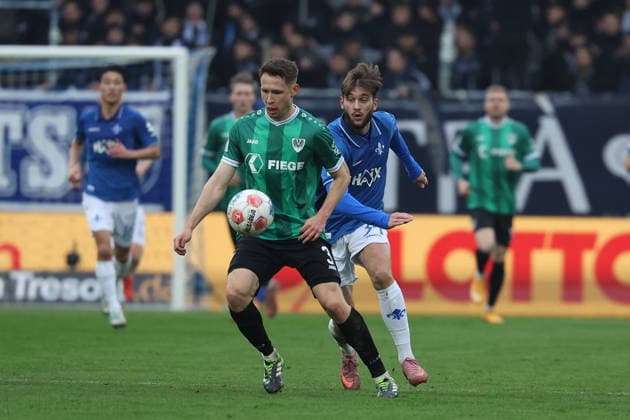 2025.12.14 xjfx 2.Bundesliga SV Darmstadt 98 - SC Preussen Muenster v.l., Paul Jaeckel (Preussen Muenster), Kilian Julian Corredor (SV Darmstadt 98) Zweikampf, Action, Aktion, Battles for the Ball (DFL DFB REGULATIONS PROHIBIT ANY USE OF PHOTOGRAPHS as IMAGE SEQUENCES and or QUASI-VIDEO)