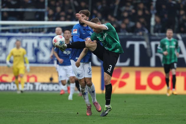 2025.12.14 xjfx 2.Bundesliga SV Darmstadt 98 - SC Preussen Muenster v.l., Kilian Julian Corredor (SV Darmstadt 98), Paul Jaeckel (Preussen Muenster), Zweikampf, Action, Aktion, Battles for the Ball (DFL DFB REGULATIONS PROHIBIT ANY USE OF PHOTOGRAPHS as IMAGE SEQUENCES and or QUASI-VIDEO)