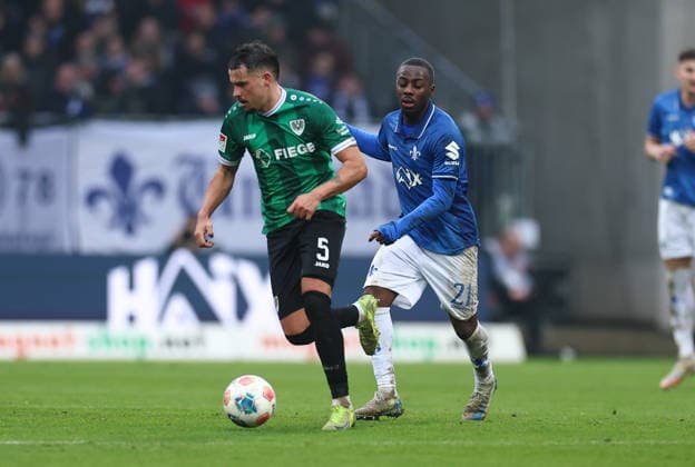 14.12.2025, Fussball 2. Bundesliga, SV Darmstadt 98 - SC Preußen Münster, emonline, emspor, despor, v.l., Yassine Bouchama (SC Preußen Münster), Merveille Papela (SV Darmstadt 98) DFL DFB REGULATIONS PROHIBIT ANY USE OF PHOTOGRAPHS AS IMAGE SEQUENCES AND OR QUASI-VIDEO. xdcx