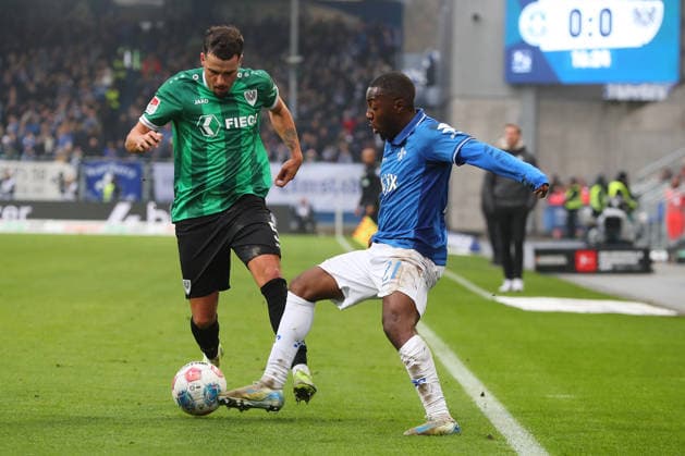 14.12.2025, xtvx, Fussball 2.Bundesliga, SV Darmstadt 98 - Preußen Münster v.l. Zweikampf, Duell, duel, tackle, compete Yassine Bouchama (Preussen Muenster) Merveille Papela (SV Darmstadt 98) (DFL DFB REGULATIONS PROHIBIT ANY USE OF PHOTOGRAPHS as IMAGE SEQUENCES and or QUASI-VIDEO) Darmstadt