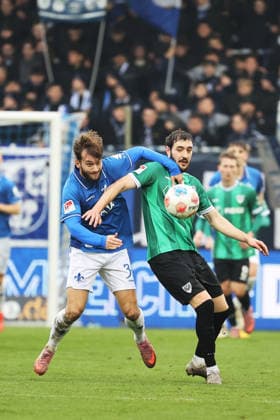 14.12.2025, xtvx, Fussball 2.Bundesliga, SV Darmstadt 98 - Preußen Münster v.l. Killian Corredor (SV Darmstadt 98) Marcel Benger (Preussen Muenster) Zweikampf, Duell, duel, tackle, compete (DFL DFB REGULATIONS PROHIBIT ANY USE OF PHOTOGRAPHS as IMAGE SEQUENCES and or QUASI-VIDEO) Darmstadt
