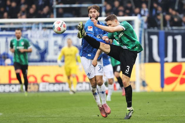 14.12.2025, xtvx, Fussball 2.Bundesliga, SV Darmstadt 98 - Preußen Münster v.l. Zweikampf, Duell, duel, tackle, compete Killian Corredor (SV Darmstadt 98) Paul Jaeckel (Preussen Muenster) (DFL DFB REGULATIONS PROHIBIT ANY USE OF PHOTOGRAPHS as IMAGE SEQUENCES and or QUASI-VIDEO) Darmstadt