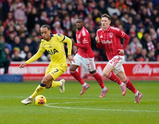 Nottingham, England, 14th December 2025. Xavi Simons of Tottenham (l) moves ahead of Elliot Anderson of Nottingham Forest (r) during the Nottingham Forest vs Tottenham Hotspur Premier League match at the City Ground, Nottingham. Picture credit should read: Andrew Yates Sportimage EDITORIAL USE ONLY. No use with unauthorised audio, video, data, fixture lists, club league logos or live services. Online in-match use limited to 120 images, no video emulation. No use in betting, games or single club league player publications. SPI_024_AY_Forest_Spurs SPI-4376-0024