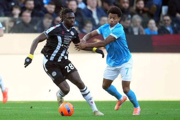UDINE, ITALY - DECEMBER 14: Oumar Solet of Udinese Calcio vies with David Neres of SSC Napoli during the match between Udinese Calcio and SSC Napoli at Bluenergy Stadium on December 14, 2025 in Udine, Italy Copyright: xFOTOAGENZIAx