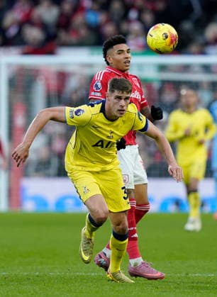 Nottingham, England, 14th December 2025. Micky van de Ven of Tottenham in front of Igor Jesus of Nottingham Forest during the Nottingham Forest vs Tottenham Hotspur Premier League match at the City Ground, Nottingham. Picture credit should read: Andrew Yates Sportimage EDITORIAL USE ONLY. No use with unauthorised audio, video, data, fixture lists, club league logos or live services. Online in-match use limited to 120 images, no video emulation. No use in betting, games or single club league player publications. SPI_063_AY_Forest_Spurs SPI-4376-0063