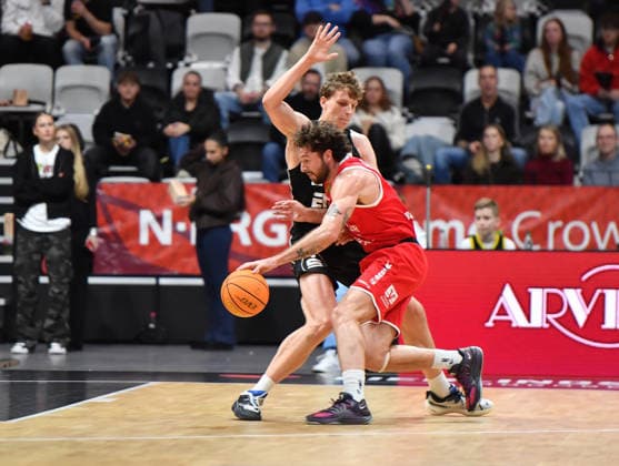 14.12.2025 - Basketball - Saison 2025 2026 - 2. Bundesliga Pro-A - 12. Spieltag: Nürnberg Falcons Basketball Club NBC - Artland Dragons - OGo - xogox - Tom Stoiber (28, Nürnberg Falcons BC NBC ) Benjamin Forrest Burnham (25, Artland Dragons )