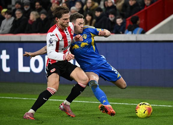 14th December 2025; Gtech Community Stadium, Brentford, London, England; Premier League Football, Brentford versus Leeds United; Mathias Jensen of Brentford tackles Gabriel Gudmundsson of Leeds United  SimonxWest