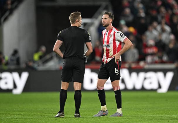 14th December 2025; Gtech Community Stadium, Brentford, London, England; Premier League Football, Brentford versus Leeds United; Jordan Henderson of Brentford talks to Referee John Brooks while his goal is checked by VAR  SimonxWest