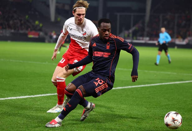 Utrecht, Netherlands, 11th December 2025. Arnaud Kalimuendo of Nottingham Forest with the ball ahead of Yoann Cathline of FC Utrecht during the FC Utrecht vs Nottingham Forest UEFA Europa League match at Stadion Galgenwaard, Utrecht. Picture credit should read: Paul Terry Sportimage EDITORIAL USE ONLY. No use with unauthorised audio, video, data, fixture lists, club league logos or live services. Online in-match use limited to 120 images, no video emulation. No use in betting, games or single club league player publications. SPI_127_PT_Utrecht_Notts_Forest_ SPI-4361-0127
