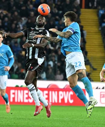 (251215) -- UDINE, Dec. 15, 2025 -- Udinese s Keinan Davis (L) vies with Napoli s Giovanni Di Lorenzo during a Serie A football match between Udinese and Napoli in Udine, Italy, Dec.14, 2025. (Photo by Xinhua) (SP)ITALY-UDINE-FOOTBALL-SERIE A- UDINESE VS NAPOLI DiegoxPetrussi 