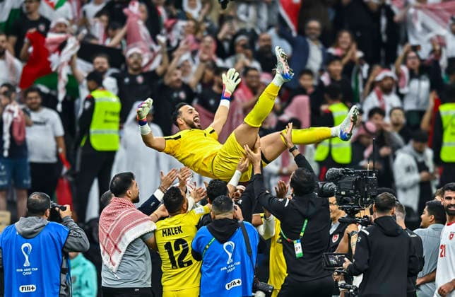 (251216) -- AL KHOR, Dec. 16, 2025 -- Jordan s team members celebrate with goalkeeper Yazeed Abulaila (top) the FIFA Arab Cup 2025 Semi-final match between Saudi Arabia and Jordan at Al Bayt Stadium in Al Khor, Qatar, on Dec. 15, 2025. (Photo by Xinhua) (SP)QATAR-AL KHOR-FIFA ARAB CUP-SEMI-FINAL-SAUDI ARABIA VS JORDAN Nikku 