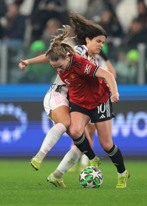Turin, Italy, 17th December 2025. Eva Schatzer of Juventus challenges Elisabeth Terland of Manchester United, ManU during the Juventus Women vs Manchester United Women UEFA Womens Champions League match at Juventus Stadium, Turin. Picture credit should read: Jonathan Moscrop Sportimage EDITORIAL USE ONLY. No use with unauthorised audio, video, data, fixture lists, club league logos or live services. Online in-match use limited to 120 images, no video emulation. No use in betting, games or single club league player publications. SPI_037_JM_JUVE_MANUTD_UWCL SPI-4364-0037