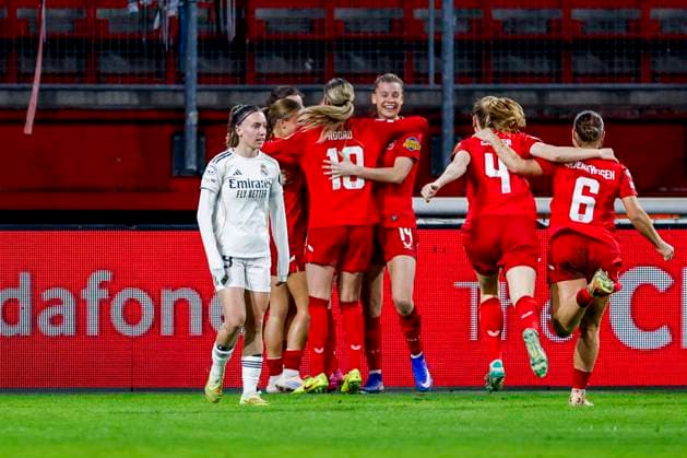 Jaimy Ravensbergen of FC Twente celebrates with teammates after scoring her teams first goal and Signe Bruun of Real Madrid looks dejected after conceding her sides first goal FC Twente v Real Madrid CF, UEFA Women s Champions League 2025 26 League Phase MD6, FC Twente v Real Madrid CF, FC Twente Stadium, December 17, 2025, Enschede, Netherlands.