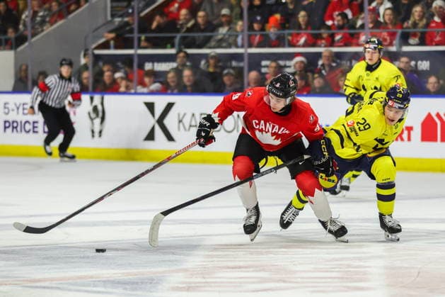 December 17, 2025, Kitchener, On, Canada: Canada s Gavin McKenna (9) tries to keep the puck from Sweden s Casper Juustovaara Karlsson (29) during second period IIHF World Junior Hockey Championship pre-tournament action in Kitchener, Ont. on Wednesday, December 17, 2025. Canada News - December 17, 2025  - ZUMAc35_ 20251217_zaf_c35_044 Copyright: xNickxIwanyshynx