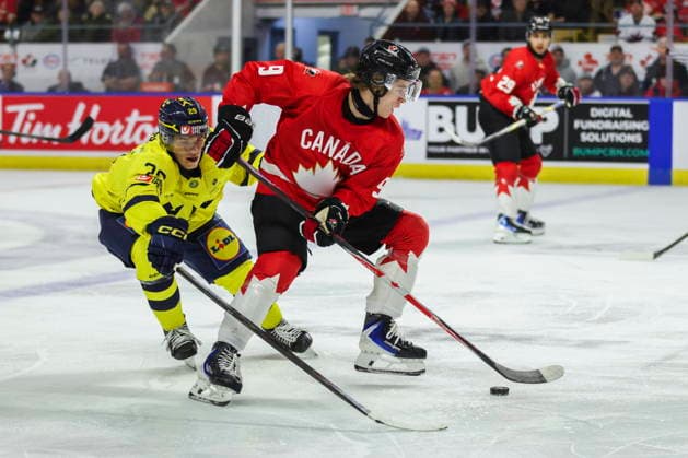 December 17, 2025, Kitchener, On, Canada: Canada s Gavin McKenna (9) tries to keep the puck from Sweden s Casper Juustovaara Karlsson (29) during second period IIHF World Junior Hockey Championship pre-tournament action in Kitchener, Ont. on Wednesday, Dec. 17, 2025. Canada News - December 17, 2025  - ZUMAc35_ 20251217_zaf_c35_062 Copyright: xNickxIwanyshynx