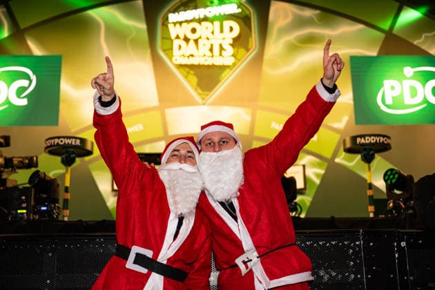 19th December 2025, Alexandra Palace, London, England; 2025 PDC Paddy Power World Darts Championship Day Nine; Fans in fancy dress as Santa stand in front of the stage at the Alexandra Palace  GodfreyxPitt