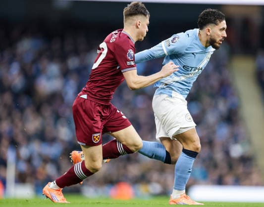 20th December 2025; Etihad Stadium, Manchester, Lancashire, England; Premier League Football, Manchester City versus West Ham United; Rayan Cherki of Manchester City tracked by Oliver Scarles of West Ham United  RogerxEvans