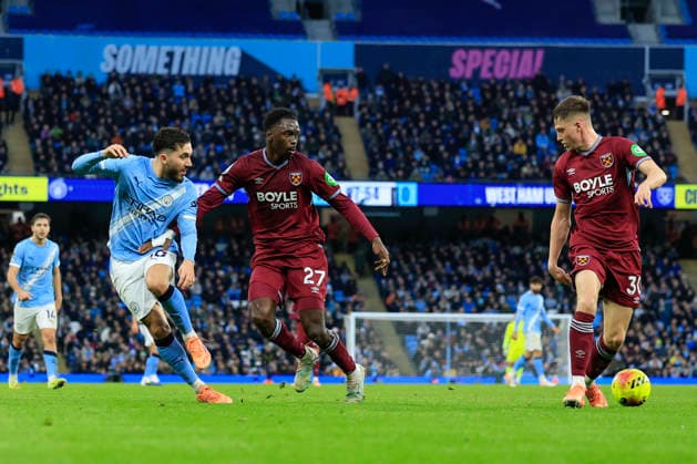 Manchester City v West Ham United Premier League 20 12 2025. Rayan Cherki (10) of Manchester City passes the ball beyond Soungoutou Magassa (27) of West Ham United during the Premier League match between Manchester City and West Ham United at the Etihad Stadium, Manchester, England on 20 December 2025. Manchester Etihad Stadium Manchester England Editorial use only DataCo restrictions apply See www.football-dataco.com , Copyright: xConorxMolloyx PSI-23451-0080