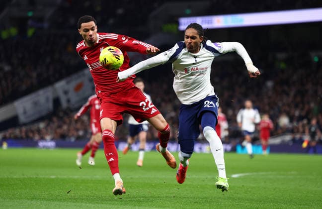 London, England, 20th December 2025. Hugo Ekitike of Liverpool and Djed Spence of Tottenham Hotspur challenge for the ball during the Tottenham Hotspur vs Liverpool Premier League match at the Tottenham Hotspur Stadium, London. Picture credit should read: Paul Terry Sportimage EDITORIAL USE ONLY. No use with unauthorised audio, video, data, fixture lists, club league logos or live services. Online in-match use limited to 120 images, no video emulation. No use in betting, games or single club league player publications. SPI_068_PT_Tottenham_Liverpool SPI-4387-0068