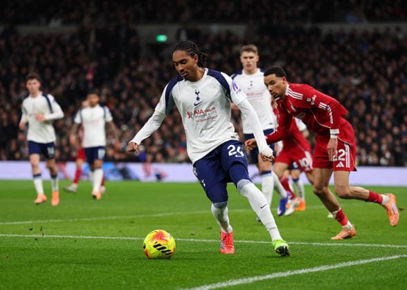 20th December 2025; Tottenham Hotspur Stadium, London, England; Premier League Football, Tottenham Hotspur versus Liverpool; Djed Spence of Tottenham Hotspur on the ball  JohnxPatrickxFletcher