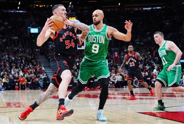 December 20, 2025, Toronto, On: Toronto Raptors Sandro Mamukelashvili (54) drives as Boston Celtics Derrick White (9) defends during first half NBA, Basketball Herren, USA basketball action in Toronto on Saturday, Dec. 20, 2025. Canada News - December 20, 2025  - ZUMAc35_ 20251220_zaf_c35_046 Copyright: xFrankxGunnx