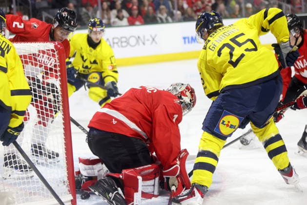 December 20, 2025, London, On, Canada: Sweden forward Eddie Genborg (25) is stopped by Canada goaltender Jack Ivankovic (1) during the first period of a IIHF World Junior Hockey Championship pre-tournament game in London, Ont., Saturday, December 20, 2025. Canada News - December 20, 2025  - ZUMAc35_ 20251220_zaf_c35_063 Copyright: xNicolexOsbornex