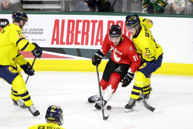 December 20, 2025, London, On, Canada: Canada forward Tij Iginla (11) protects the puck from Sweden forward Ivar Stenberg (15) during the second period of a IIHF World Junior Hockey Championship pre-tournament game in London, Ont., Saturday, December 20, 2025. Canada News - December 20, 2025  - ZUMAc35_ 20251220_zaf_c35_070 Copyright: xNicolexOsbornex