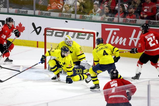 December 20, 2025, London, On, Canada: Canada forward Cole Reschny (21) shoots over Sweden goaltender Love Harenstam (30) during the third period of a IIHF World Junior Hockey Championship pre-tournament game in London, Ont., Saturday, December 20, 2025. Canada News - December 20, 2025  - ZUMAc35_ 20251220_zaf_c35_091 Copyright: xNicolexOsbornex