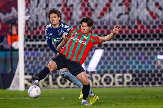 Ko Itakura of AFC Ajax and Kento Shiogai of NEC battle for the ball NEC Nijmegen v AFC Ajax, Eredivisie, NEC v AFC Ajax, Goffertstadium, December 20, 2025, Nijmegen, Netherlands.
