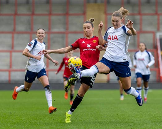 21st December 2025; Leigh Sports Village, Manchester, England; Womens League Cup Football Quarter Final, Manchester United, ManU versus Tottenham Hotspur; Clare Hunt of Tottenham Hotspur Women under pressure from Julia Zigiotti Olme of Manchester United Women  TimxWilliams
