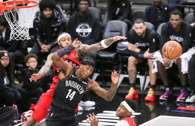 (251222) -- NEW YORK, Dec. 22, 2025 -- Terance Mann (front) of Brooklyn Nets competes during the 2025-2026 NBA, Basketball Herren, USA regular season game between Brooklyn Nets and Toronto Raptors in New York, the United States, Dec. 21, 2025. ) (SP)U.S.-NEW YORK-BASKETBALL-NBA-RAPTORS VS NETS ZhangxFengguo 