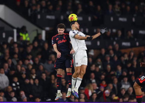 22nd December 2025; Craven Cottage, Fulham, London, England; Premier League Football, Fulham versus Nottingham Forest; Raul Jimenez of Fulham heads the ball over Neco Williams of Nottingham Forest  JohnxPatrickxFletcher