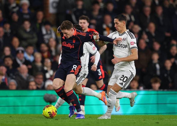 22nd December 2025; Craven Cottage, Fulham, London, England; Premier League Football, Fulham versus Nottingham Forest; Elliot Anderson of Nottingham Forest challenged by Sasa Lukic of Fulham  JohnxPatrickxFletcher