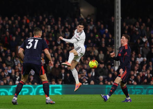 22nd December 2025; Craven Cottage, Fulham, London, England; Premier League Football, Fulham versus Nottingham Forest; Harry Wilson of Fulham closely marked by Nikola Milenkovic and Elliot Anderson of Nottingham Forest  JohnxPatrickxFletcher