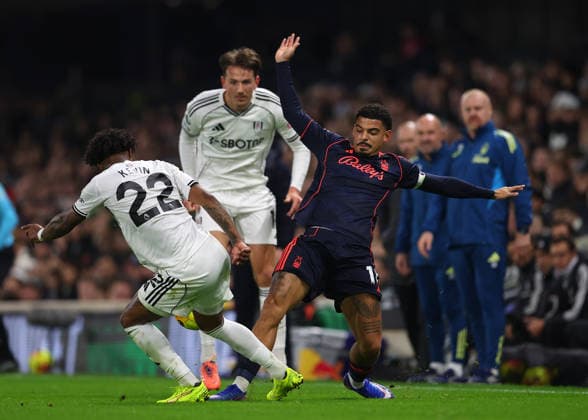 22nd December 2025; Craven Cottage, Fulham, London, England; Premier League Football, Fulham versus Nottingham Forest; Morgan Gibbs-White of Nottingham Forest challenged by Kevin of Fulham  JohnxPatrickxFletcher