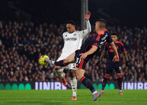 22nd December 2025; Craven Cottage, Fulham, London, England; Premier League Football, Fulham versus Nottingham Forest; Kenny Tete of Fulham challenged by Nikola Milenkovic of Nottingham Forest  JohnxPatrickxFletcher