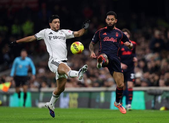 London, England, 22nd December 2025. Raul JimÃ nez of Fulham with Douglas Luiz of Nottingham Forest during the Fulham vs Nottingham Forest Premier League match at Craven Cottage, London. Picture credit should read: David Klein Sportimage EDITORIAL USE ONLY. No use with unauthorised audio, video, data, fixture lists, club league logos or live services. Online in-match use limited to 120 images, no video emulation. No use in betting, games or single club league player publications. SPI_DK_039_Fulham_Forest SPI-4392-0039
