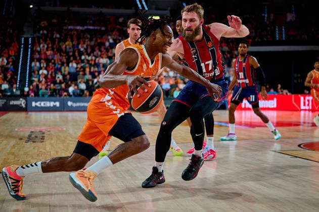 December 23, 2025, Valencia, Spain: Brancou Badio of Valencia Basket and Gytis Radzevicius of Kosner Baskonia Vitoria-Gasteiz seen in action during the EuroLeague Basketball regular season gameday 18, between Valencia Basket (ESP) and Kosner Baskonia Vitoria-Gasteiz (ESP) at Roig Arena. Final scores: Valencia Basket 91-81 Kosner Baskonia Valencia Spain - ZUMAs197 20251223_aaa_s197_107 Copyright: xDavidxPastorxAndresx