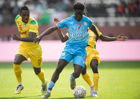 Congo DR v Benin: Group D - Africa Cup Of Nations RABAT, MOROCCO - DECEMBER 23: Nathanael Mbuku of Congo DR (centre) holds off Rachid Moumini and Sessi D Almeida of Benin (left) and during the Africa Cup Of Nations Group D match between Congo DR and Benin at on December 23, 2025 in Rabat, Morocco. Rabat Morocco Copyright: xVisionhausx 776422241
