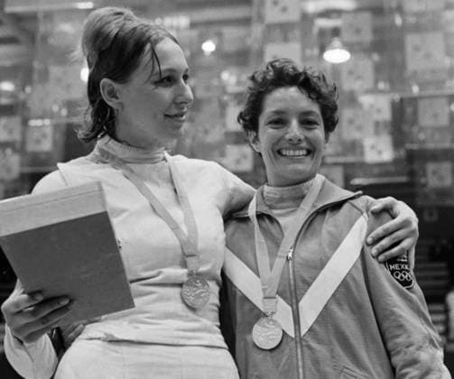 Mexico City, Mexico. Soviet athlete Elena Novikova who won first place and Mexican athlete Pilar Roldan who won second place in foil fencing (L-R) pose for a photo during the medal ceremony of the 1968 Summer Olympics in the Fernando Montes de Oca fencing hall. Viktor Shandrin TASS  32395192