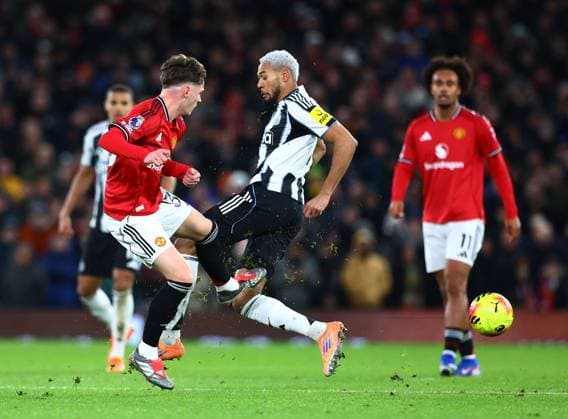 Jack Fletcher of Manchester United, ManU and Joelinton of Newcastle United Manchester United v Newcastle United, Premier League, Football, Old Trafford, Manchester, UK - 26 Dec 2025Manchester Old Trafford United Kingdom EDITORIAL USE ONLY No use with unauthorised audio, video, data, fixture lists, club league logos or live services. Online in-match use limited to 120 images, no video emulation. No use in betting, games or single club league player publications. Copyright: xMattxWest Shutterstockx 16191667ah