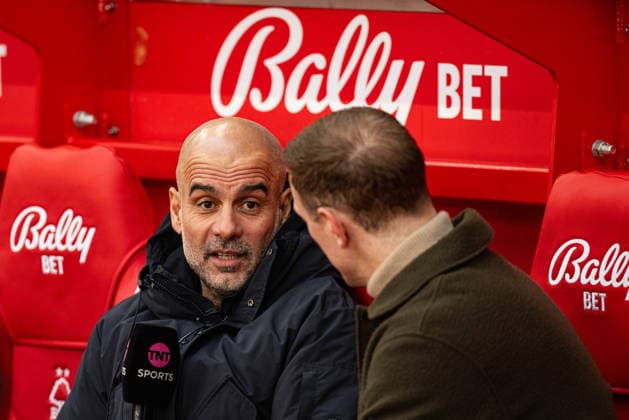 27th December 2025; The City Ground, Nottingham, England; Premier League Football, Nottingham Forest versus Manchester City; Manchester City Manager Pep Guardiola is interviewed by former England goalkeeper Joe Hart before kick-off  GodfreyxPitt