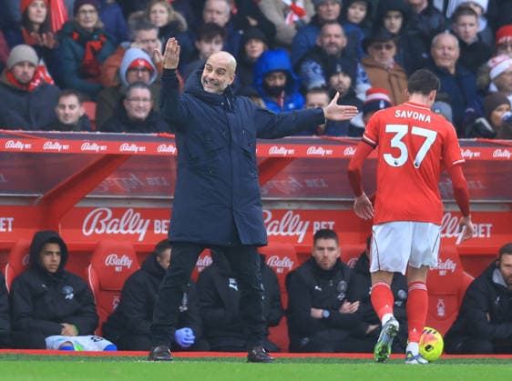 Nottingham, England, 27th December 2025. Pep Guardiola coach of Manchester City gestures towards his players during the Nottingham Forest vs Manchester City Premier League match at the City Ground, Nottingham. Picture credit should read: Jessica Hornby Sportimage EDITORIAL USE ONLY. No use with unauthorised audio, video, data, fixture lists, club league logos or live services. Online in-match use limited to 120 images, no video emulation. No use in betting, games or single club league player publications. SPI_033_JH_Forest_ManC SPI-4395-0033