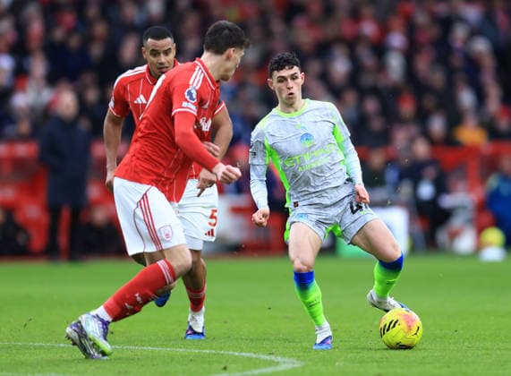 Nottingham, England, 27th December 2025. Phil Foden of Manchester City (r) tussles with NicolÃ² Savona of Nottingham Forest during the Nottingham Forest vs Manchester City Premier League match at the City Ground, Nottingham. Picture credit should read: Jessica Hornby Sportimage EDITORIAL USE ONLY. No use with unauthorised audio, video, data, fixture lists, club league logos or live services. Online in-match use limited to 120 images, no video emulation. No use in betting, games or single club league player publications. SPI_052_JH_Forest_ManC SPI-4395-0052
